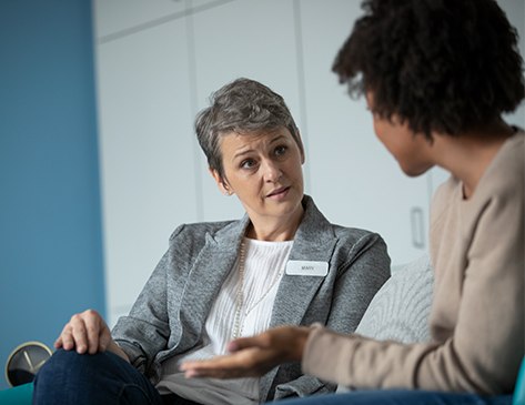 Female mental health professional speaking to a female patient