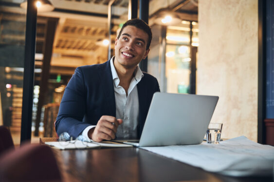 A businessman is on a computer.
